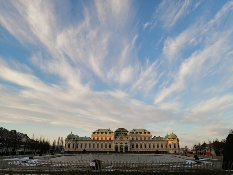 Belvedere Palace Vienna in the evening with impressive cloud formations and snow on the ground