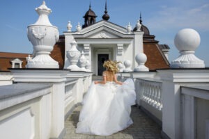 Bride in white dress running away from her wedding