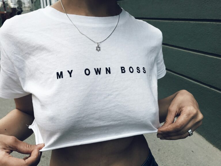 Women with a white t-shirt with phrase My Own Boss on it