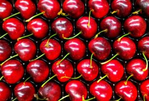Ripe cherries in a plastic tray