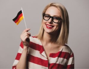 Blonde German woman holding the German flag